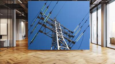 Metal electric pole on a blue sky background Wall mural