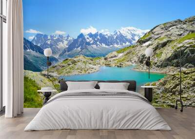 Beautiful landscape of French Alps. Turquoise Lake Blanc, in French Lac Blanc photographed on a sunny summer day with Mount Blanc and other high Alpine mountains in background. Amazing nature, France Wall mural