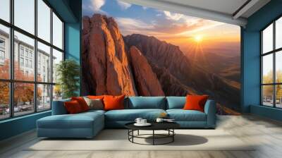 Glowing sunset over a mountain range, highlighting the rugged rock formations Wall mural