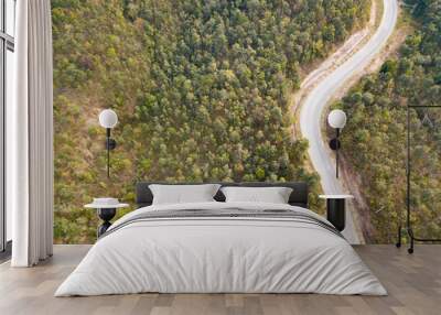 Aerial view flying over jungle with road two lane - Image Wall mural