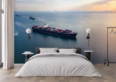 Aerial view from drone, a cargo vessel with peaceful sea in beautiful scenic sky. Professional business logistics and transportation of cargo ship. Wall mural