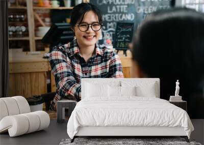 Smiling female candidate shaking hand with lady hr human resource manager in cafe bar. young girl joyful join new company got chance to work in dream office. success applicant job seeker coffee shop Wall mural