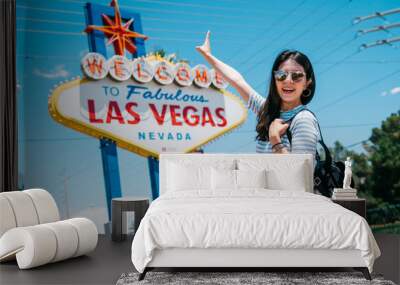 traveler pointing to the famous city sign Wall mural