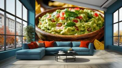 Fresh and Flavorful Guacamole in a Rustic Wooden Bowl with Tortilla Chips Wall mural