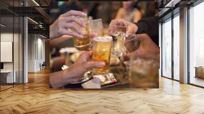 People holding beer glass, drinking cocktail together at bar, Wall mural