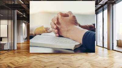 Prayer and bible concept. Caucasian men praying, hope for peace and free from coronavirus, Hand in hand together by businessman, believes and faith in christian religion at church. Wall mural