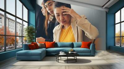 Stressed businesswoman, Frustrated, upset with business pressure, and overworked at office. Group of businesspeople working and meeting feeling tired and headache-banner image. Wall mural