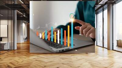 Businesswoman analyzing company's business financial balance sheet working with digital augmented reality graphics, Businesswoman calculates financial data for long-term investment. Wall mural