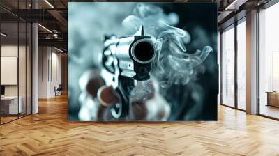 Close-up view of a handgun with smoke around the barrel, emphasizing its power and intensity in a dramatic scene. Wall mural