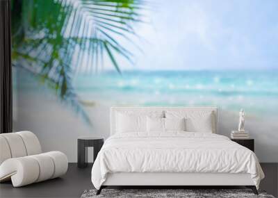 Beautiful view of  blue sea and white beach with coconut leaves.Blur image. Wall mural