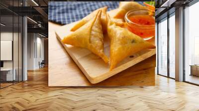 Samosas on wooden board. Wall mural