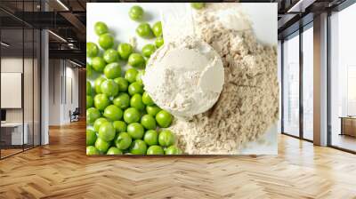 Plant base protein Pea Protein Powder in plastic scoop with fresh green Peas seeds on white Background, isolated copy space.  Wall mural