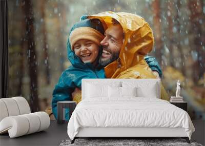 Dad and child sharing a raincoat, their faces lit up with joy as they enjoy a rainy day outside. The special bond between father and child is evident. Wall mural