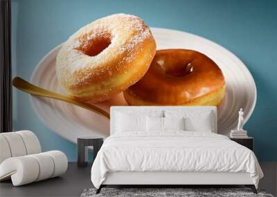 delicious donuts on white plate with and spoon Wall mural