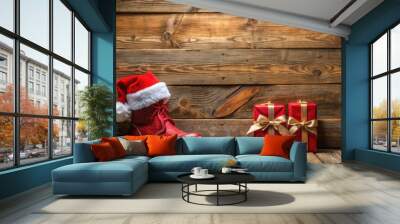 Advent calendar and Santa's shoe with gifts on rustic wooden background Wall mural