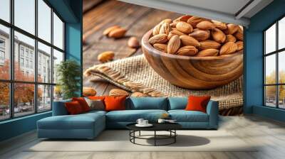 Delicious almond nuts in a rustic wooden bowl on a textured table setting Wall mural