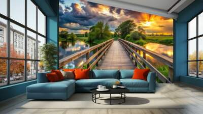 Scenic wooden bridge crossing river under stormy sunset in nature park Wall mural