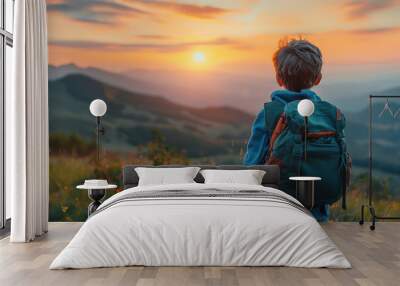 back view of school boy with backpack on mountain thinking Wall mural