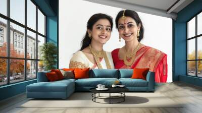 Indian Bengali mother and daughter wearing traditional Durga Puja Red and white sarees, smiling with joy Wall mural