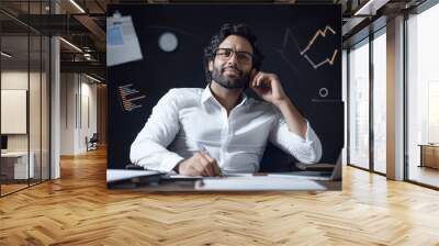 indian businessman analysing stock market graph and charts Wall mural