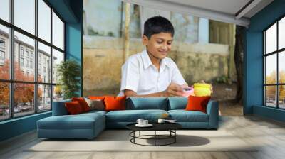 Indian child writing A B C D alphabet on Chalkboard Wall mural