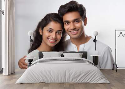 Indian couple hugging to each other and smiling on white background. Wall mural