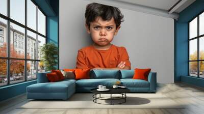 Indian little boy giving angry expression Wall mural