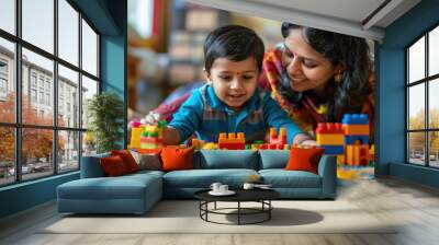 Indian mother and boy play with toys block Wall mural