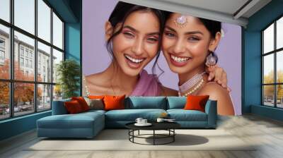 Two Beautiful modern Indian women, clear glowing skin, smiling, light purple background Wall mural