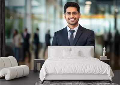 Young and confident businessman standing at office Wall mural