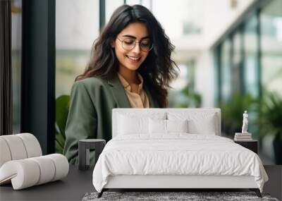 Young businesswoman using smartphone Wall mural