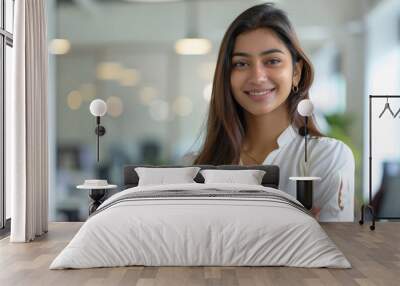 young indian business woman standing at office Wall mural