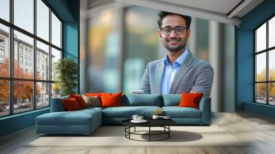 young indian businessman using smartphone Wall mural