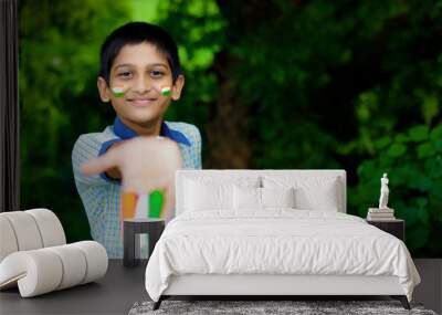 young indian child with indian flag on face Wall mural