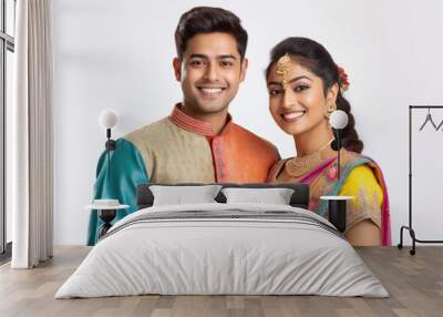 Young indian couple in traditional wear and giving happy expression Wall mural