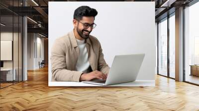 young indian man using laptop Wall mural