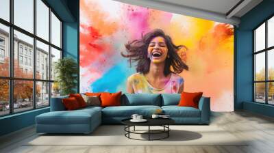 Young indian woman celebrating holi festival Wall mural