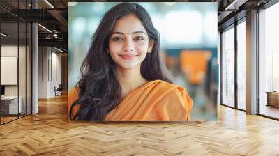 young indian woman sitting in waiting room at airport Wall mural