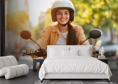 young indian woman wearing helmet and riding electric scooter Wall mural