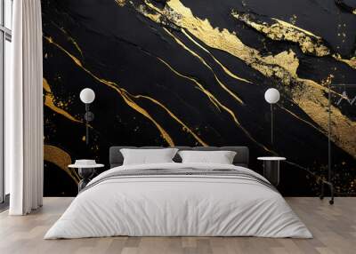 A matte black background with gold foil accents. The shimmering gold elements create a striking contrast against the deep black, evoking a sense of opulence and elegance. Wall mural