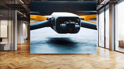 an aerial camera with two drone wheels and a yellow housing, Wall mural