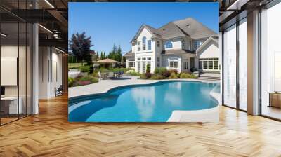 Beautiful home exterior and large swimming pool on sunny day with blue sky. Features series of water jets forming arches. Wall mural