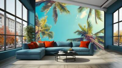 Blue sky and palm trees view from below, vintage style, tropical beach and summer background, travel concept Wall mural