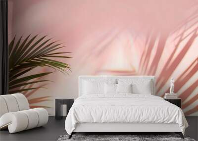 Blurred shadow from palm leaves on the light pink wall. Minimal abstract background for product presentation. Spring and summer. Wall mural