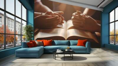 Christian group are praying to god with the bible and sharing the gospel. Concept of faith for god. Wall mural