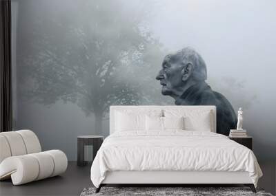 Elderly man standing alone in fog symbolizing the profound loneliness and isolation that can accompany Alzheimers disease Wall mural