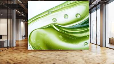 Explore the essence of wellness in this closeup of a vibrant green cosmetic serum, highlighting its natural ingredients and invigorating textures that enhance vitality and rejuvenation Wall mural