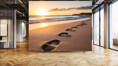 footprints are lead along the sand along the beach at sunrise, Wall mural