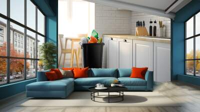 Full trash bin in interior of modern kitchen Wall mural