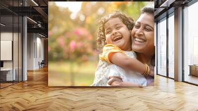 Happy indian mother having fun with her daughter outdoor - Family people and love concept - Focus on mum face Wall mural